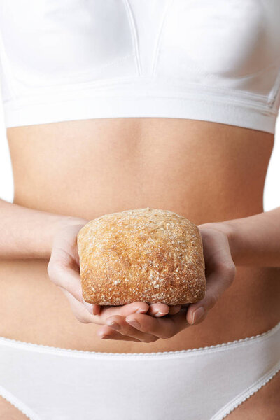 Close Up Of Woman Wearing Underwear Holding Bread Roll