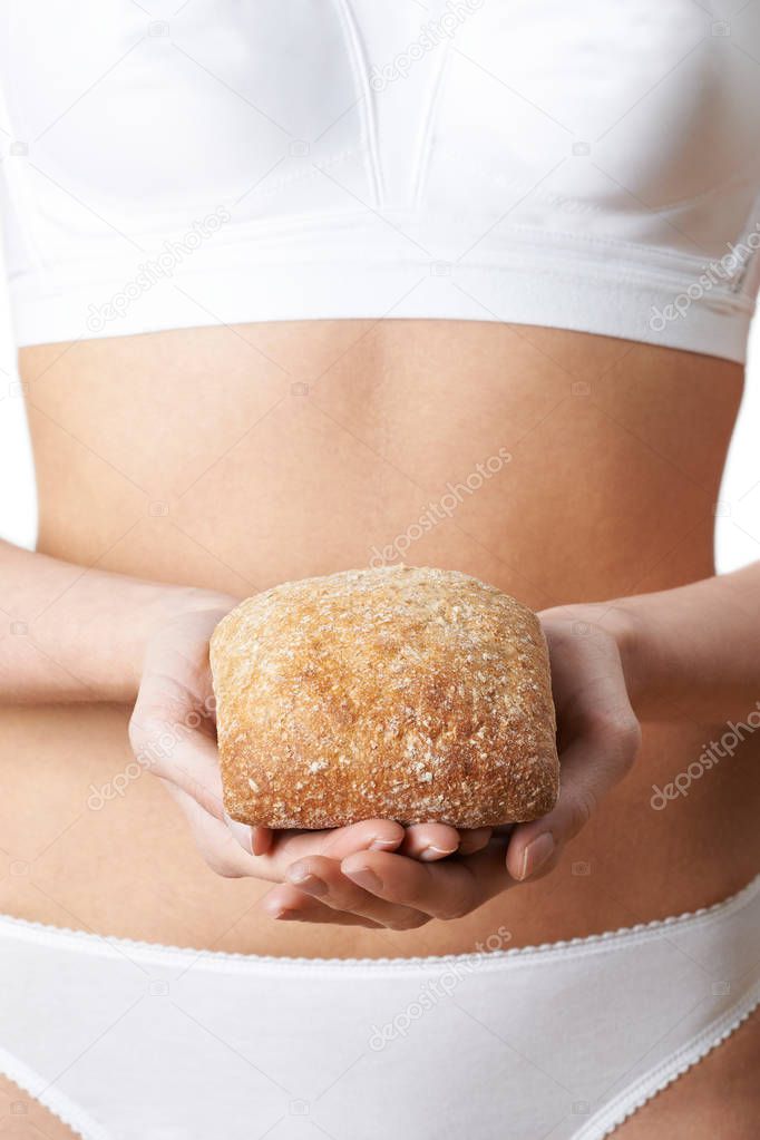 Close Up Of Woman Wearing Underwear Holding Bread Roll