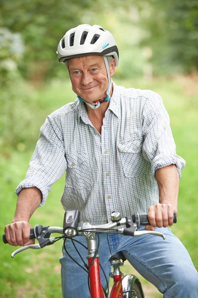 Senior Man Enjoying Cycle Ride In The Countryside — Stock Photo, Image