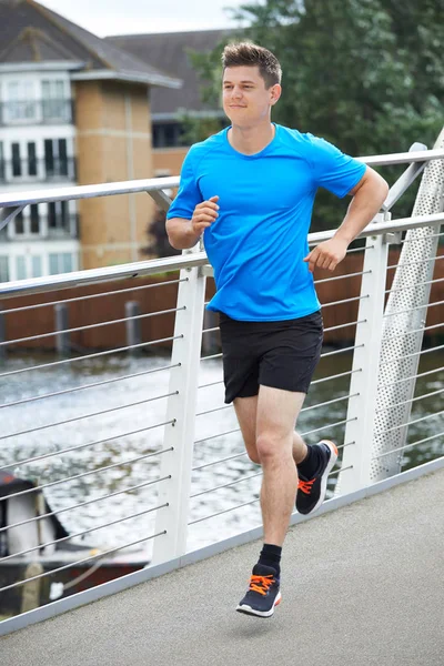 Young Man Running In Urban Setting — Stock Photo, Image