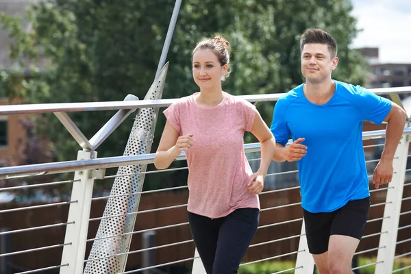 Young Couple Exercising In Urban Environment — Stock Photo, Image