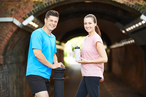Portrait Of Couple Taking A Break During Exercise In Urban Envir — Stock Photo, Image