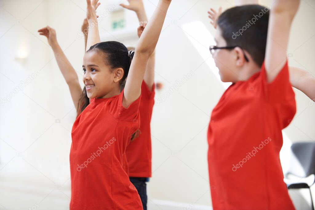 Group Of Children Enjoying Dance Class Together