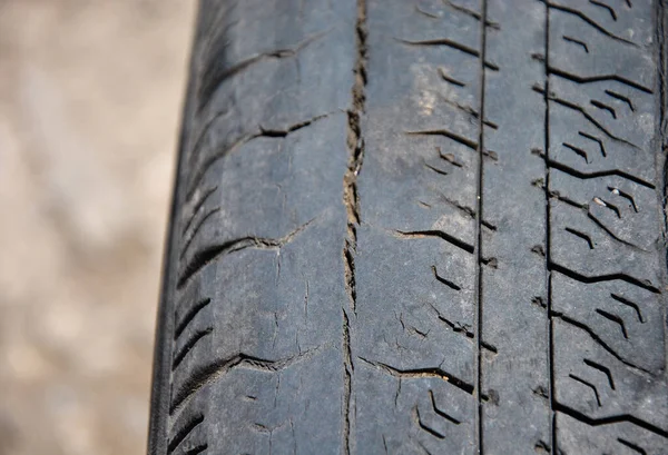 tire wear. damaged tire. old tire blurred background