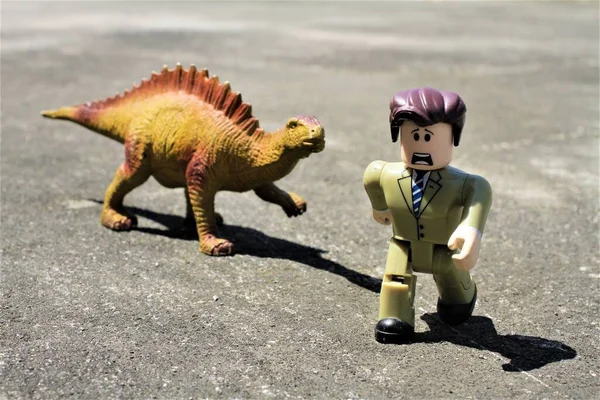 image of a  Lego toy and Dinosaur Toy