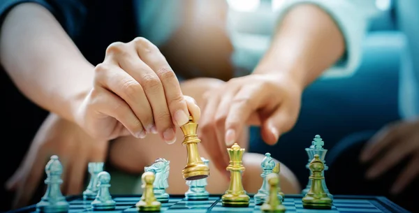 Close up of a businessman\'s hand is moving chess Strategic marketing planning by competitor analysis will make business successful as planned. Mergers or joint operations. Concept honest work