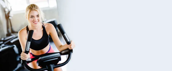 Women Wearing Sportswear Doing Workout Activity Spinning Electric Bicycle Gym — Stock Photo, Image