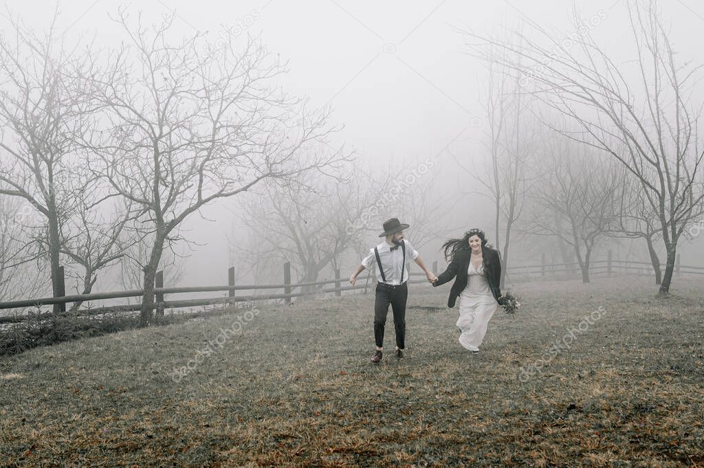 gorgeous bride and stylish groom, boho wedding couple, luxury ceremony at mountains with amazing view, space for text