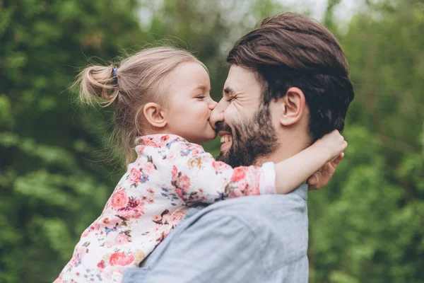 Father And Daughter Having Fun In Park. Parent And His Child Relaxing And Spending Leisure Time Together Outdoors In Nature.