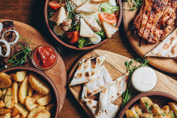 delicious European and Slavic cuisine on the big table waiting for guests. table with food, top view