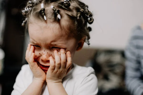 Portrait of beautiful baby girl crying emotionally. Child emotions and child crying