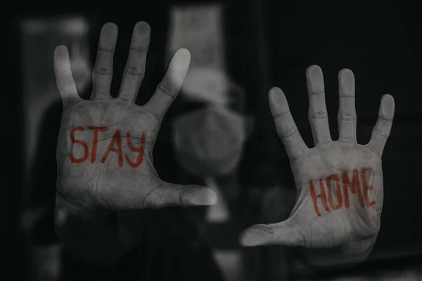 Young Man Looks Out Window Inscription Stay Home Palm His — Stock Photo, Image