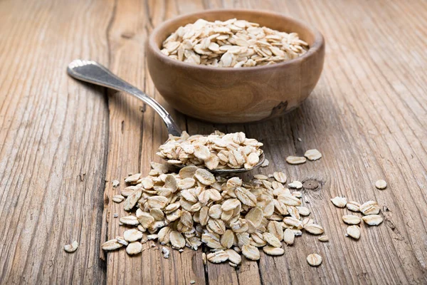 Copos Avena Tazón Con Cuchara Sobre Fondo Madera — Foto de Stock