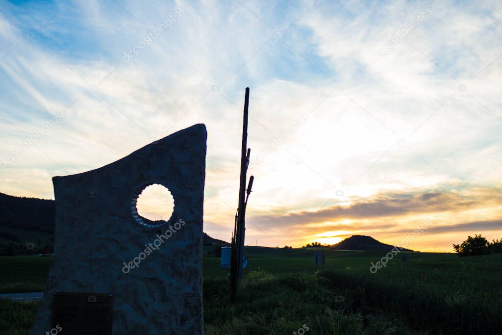 sculpture with colorful sunset sky background in spring.