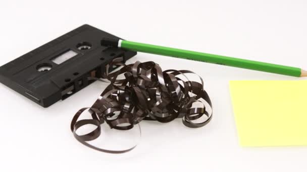Old cassette, vintage audio tape pencil and note. Remembering old technology — Stock Video