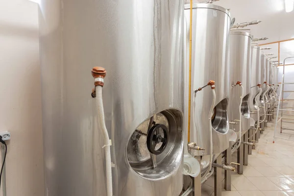 Beer factory, beer tanks are covered with drops of water