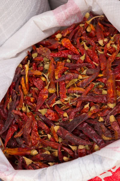 heaps of spices on display on market in morocco