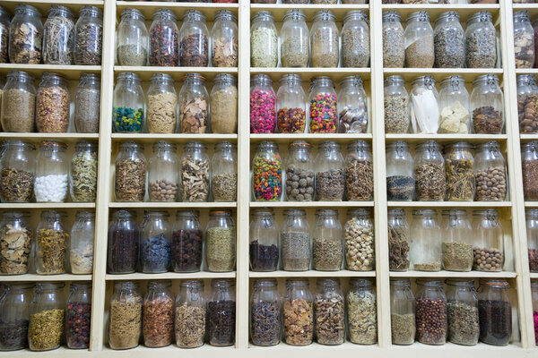 jars with spices in market stall, moricco