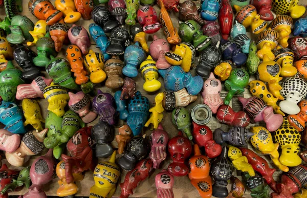 pattern of wooden toy figures at souvenir shop in zanzibar, tanzania