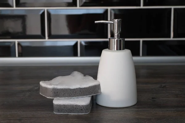 Dishwashing Liquid Dispenser Sponge Washing Dishes Wooden Table Background Black — Stock Photo, Image