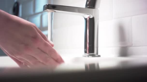 Washing hands in beautiful bathroom, saving water. — Stock Video