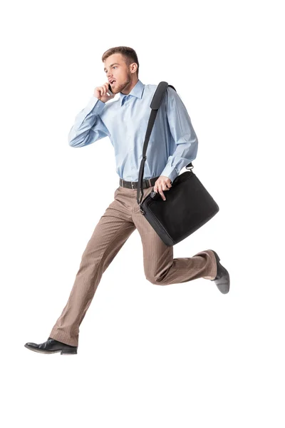 Homem de negócios correndo e falando por telefone — Fotografia de Stock