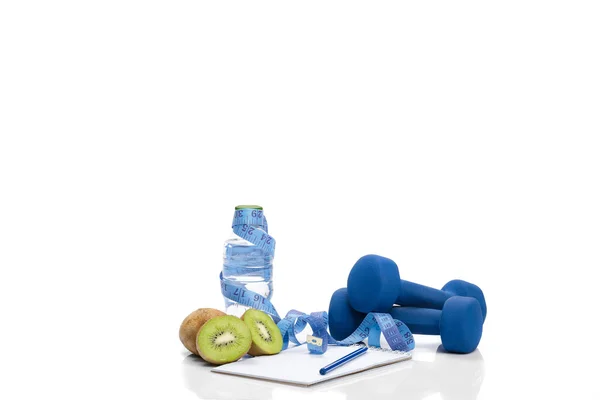 Diet and detox . dumbbells, kiwi  water — Stock Photo, Image