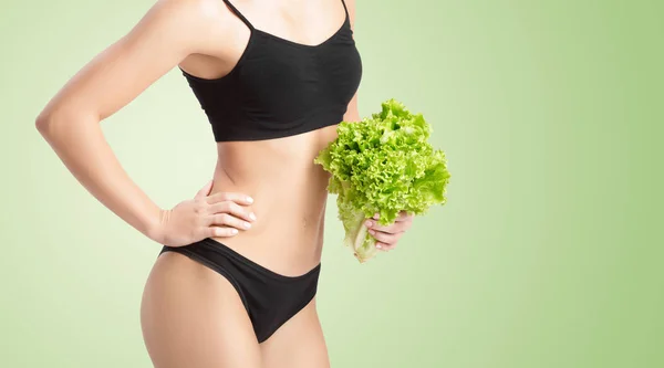 Healthy woman with salad leaves — Stock Photo, Image