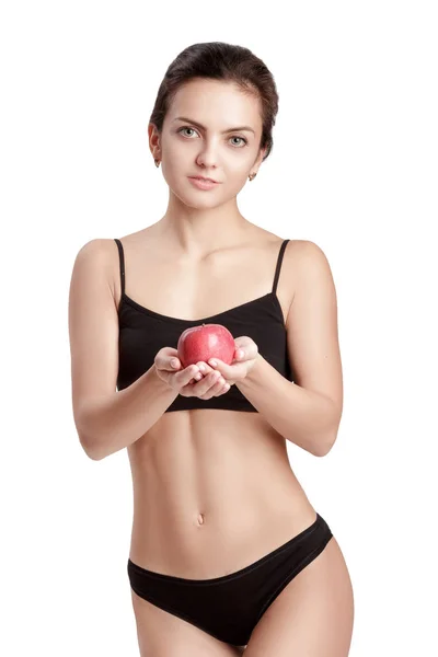 Mulher saudável jovem bonita com uma maçã vermelha . — Fotografia de Stock