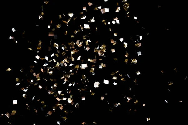 Arany konfetti fekete háttér — Stock Fotó