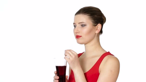 Brunette woman drinking cherry juice from glass — Stock Video