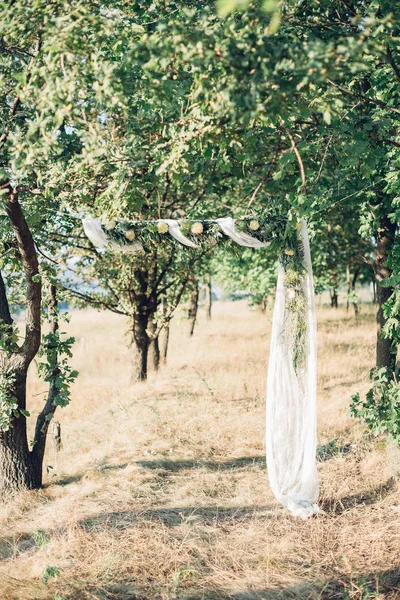 wedding arch rustic in nature.