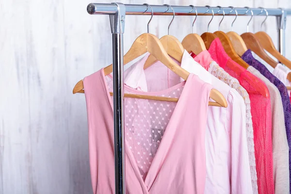 Pink womens clothes on hangers on rack in fashion store. closet — Stock Photo, Image