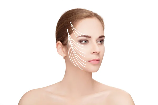 Spa portrait of woman with arrows on her face on white backgroun — Stock Photo, Image