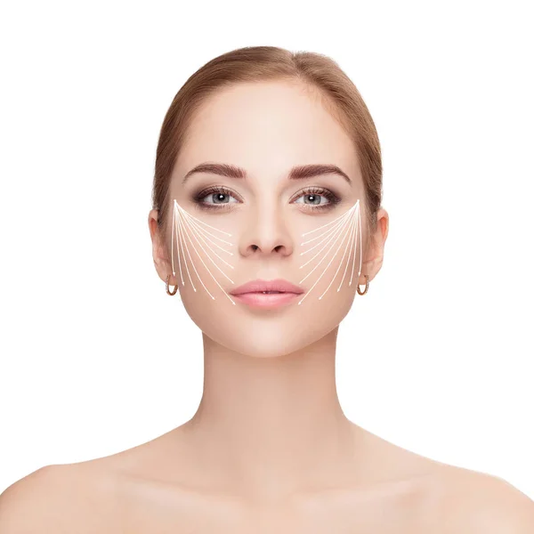 Spa portrait of woman with arrows on her face on white backgroun — Stock Photo, Image