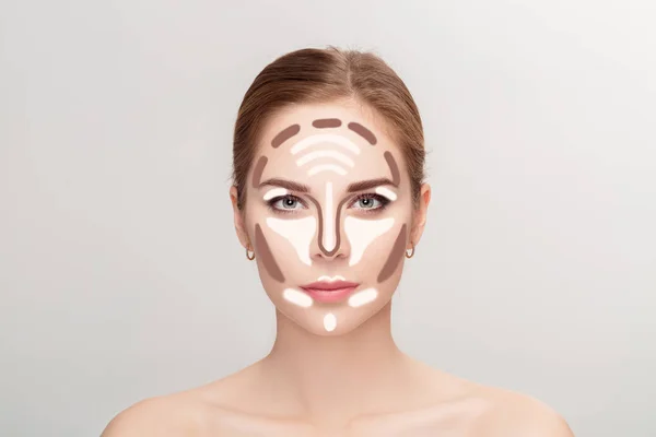 Contouring. Maquillaje cara de mujer sobre fondo gris. Profesional — Foto de Stock