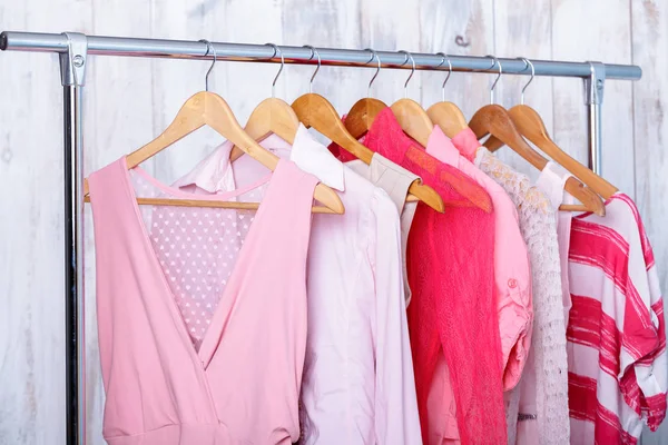 Pink womens clothes on hangers on rack in fashion store. closet — Stock Photo, Image