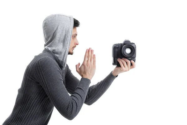 Young professional photographer prays for DSLR digital camera is — Stock Photo, Image