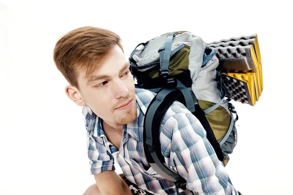 Portrait of young hiker with backpack on white background — Stock Photo, Image