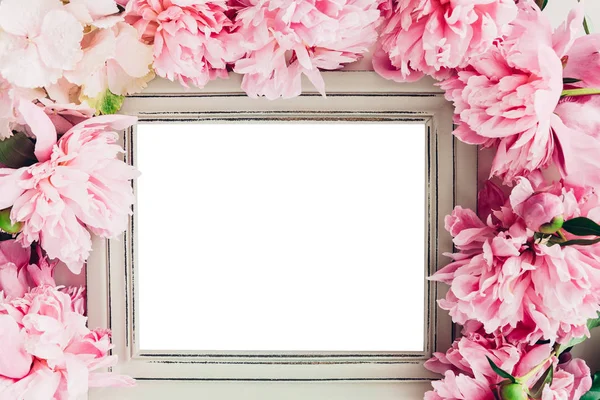 Pastel wooden frame decorated with peonies flowers, space for text. mock up — Stock Photo, Image