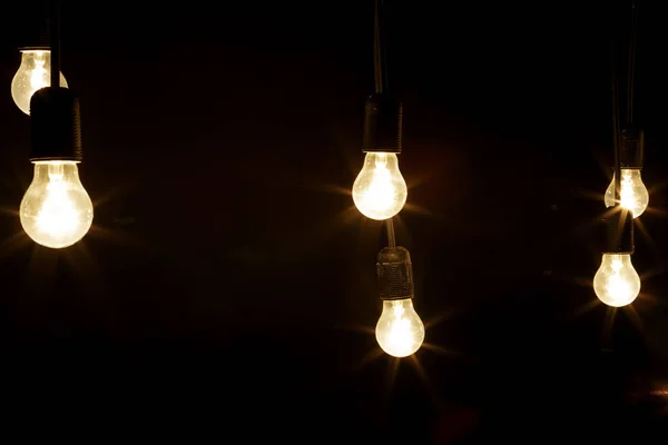 Light bulbs on a black background — Stock Photo, Image