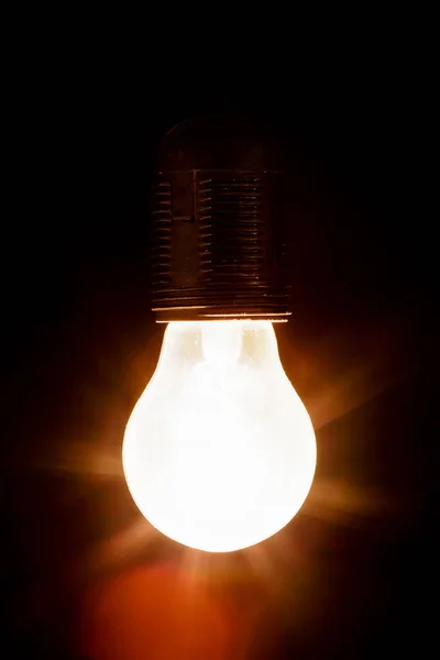 Light bulb on a black background — Stock Photo, Image