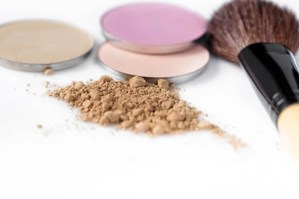 Beige powder for face, eye shadow and makeup brush  on white background — Stock Photo, Image