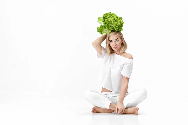 Beautiful blond woman in white blouse holding fresh green salad on white background. Health and Diet — Stock Photo, Image