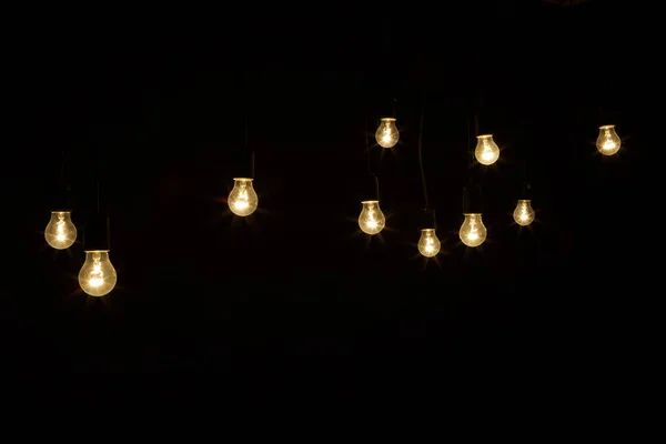 Light bulbs on a black background — Stock Photo, Image