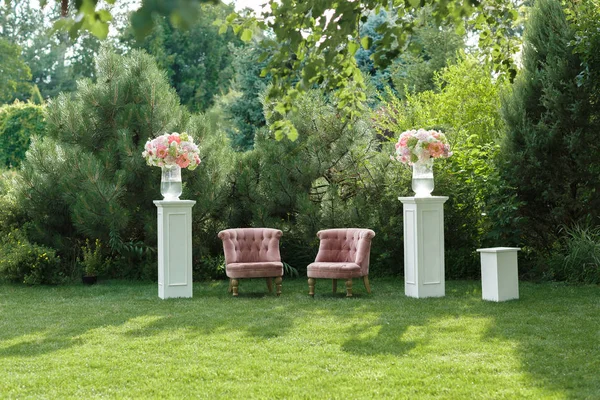 photo zone with beautiful armchair at a wedding decorated