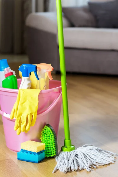 Plastic bucket with cleaning product at home