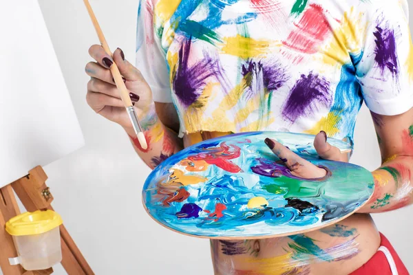 Female artist holding  palette with paints for drawing — Stock Photo, Image