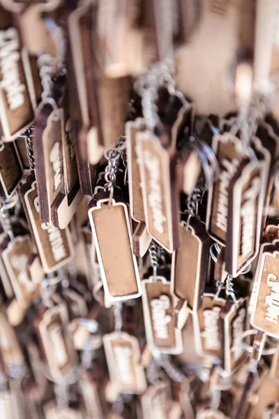 lot of wooden key fobs in the market.
