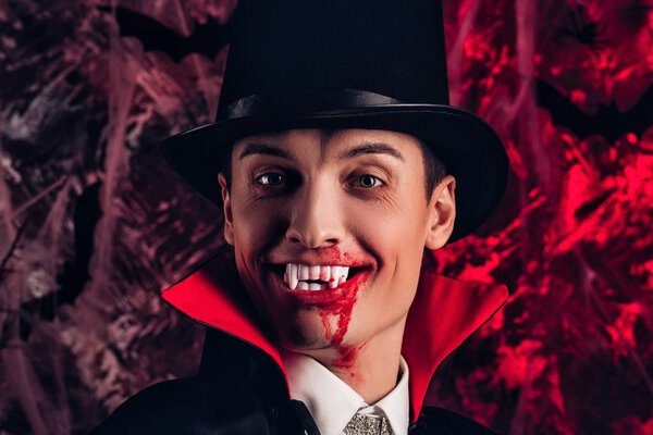handsome man dressed in a Dracula costume for Halloween.